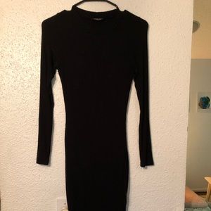 Black, tight, high slit dress with long sleeves